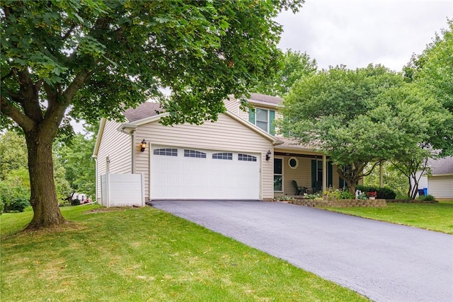 15 Chesapeake Lndg, Henrietta, NY 14586 - view of front of property with a garage, asphalt driveway, and a front yard