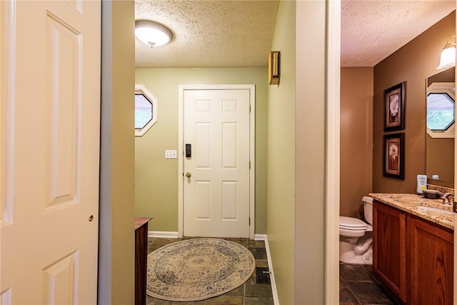 15 Chesapeake Lndg, Henrietta, NY 14586 - bathroom featuring a textured ceiling and vanity