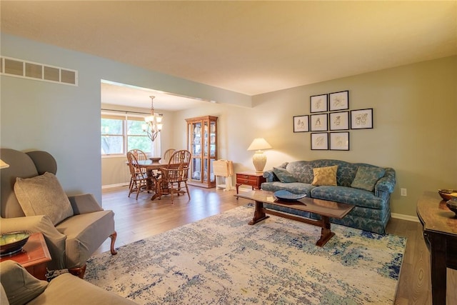 15 Chesapeake Lndg, Henrietta, NY 14586 - living area with a chandelier and wood finished floors