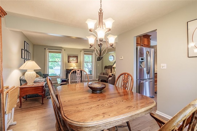 15 Chesapeake Lndg, Henrietta, NY 14586 - dining space featuring a chandelier and light wood finished floors