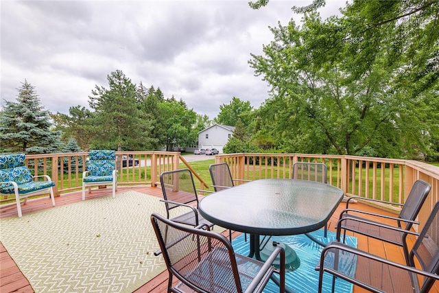 15 Chesapeake Lndg, Henrietta, NY 14586 - wooden deck featuring outdoor dining area and view of wooded area