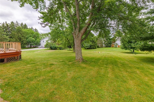 15 Chesapeake Lndg, Henrietta, NY 14586 - view of green lawn with a wooden deck