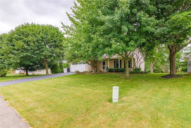 15 Chesapeake Lndg, Henrietta, NY 14586 - view of front of property featuring driveway, an attached garage, and a front yard