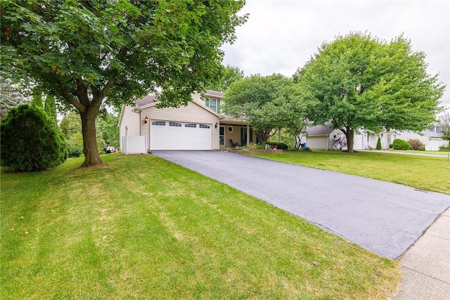 15 Chesapeake Lndg, Henrietta, NY 14586 - view of property hidden behind natural elements featuring an attached garage, asphalt driveway, and a front yard
