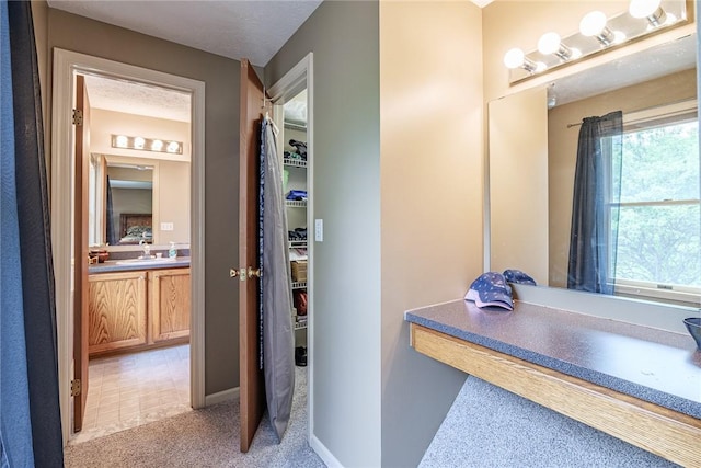 15 Chesapeake Lndg, Henrietta, NY 14586 - bathroom with vanity and a walk in closet