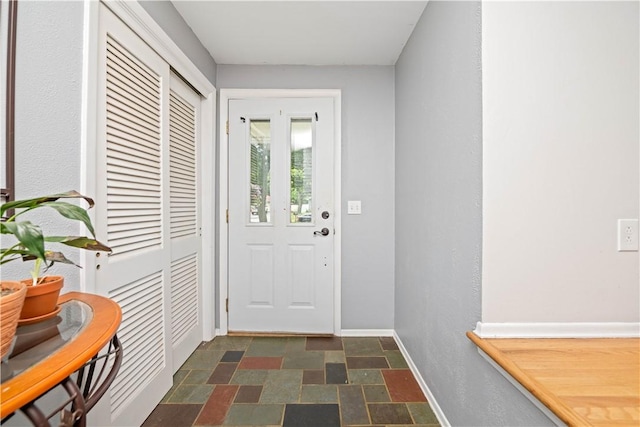 99 Dorian Ln, Greece, NY 14626 - entryway with baseboards and stone finish flooring