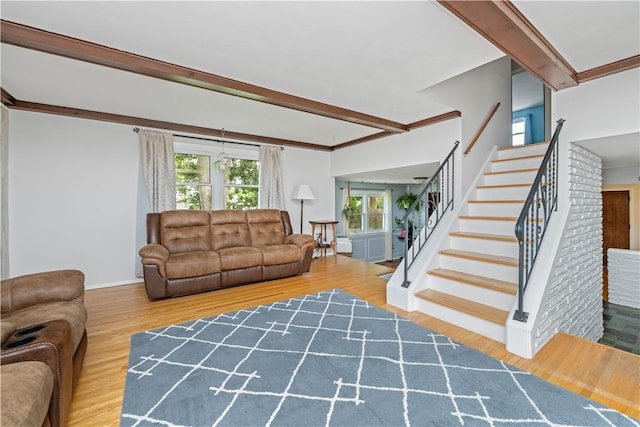 99 Dorian Ln, Greece, NY 14626 - living area with stairway, wood finished floors, and beamed ceiling