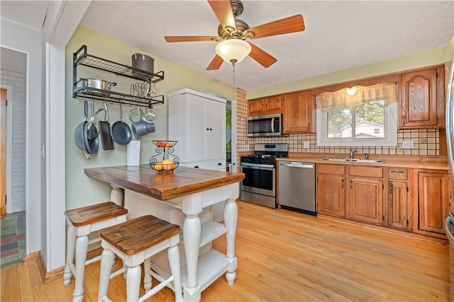 99 Dorian Ln, Greece, NY 14626 - kitchen featuring stainless steel appliances, tasteful backsplash, open shelves, and butcher block countertops