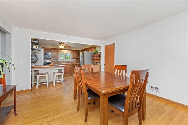 99 Dorian Ln, Greece, NY 14626 - dining space featuring light wood-type flooring and ceiling fan