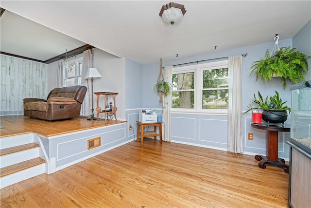 99 Dorian Ln, Greece, NY 14626 - living area with light wood-style floors and a decorative wall