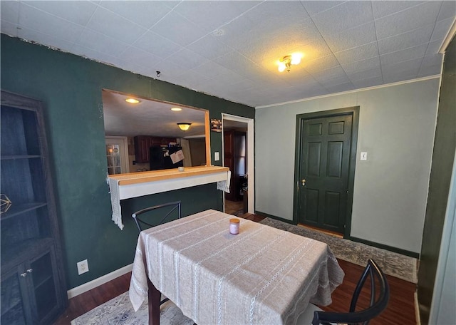 37 Pulaski St, Auburn, NY 13021 - dining space featuring wood finished floors and baseboards