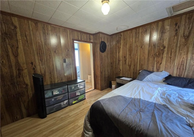 37 Pulaski St, Auburn, NY 13021 - bedroom featuring wood finished floors and wooden walls