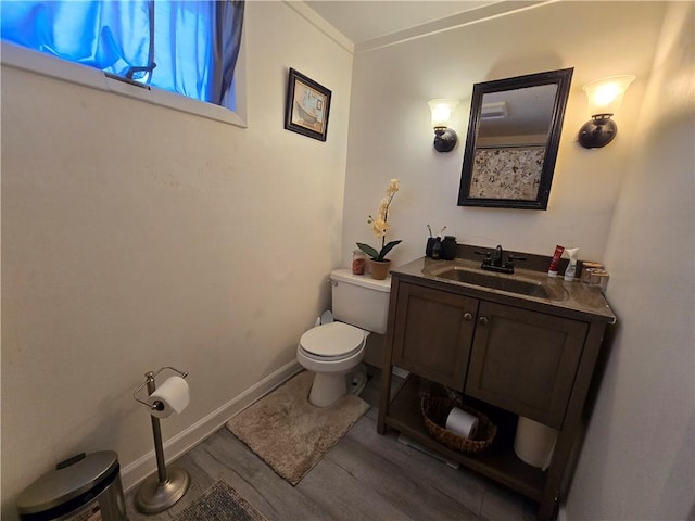37 Pulaski St, Auburn, NY 13021 - bathroom featuring wood finished floors, vanity, and ornamental molding