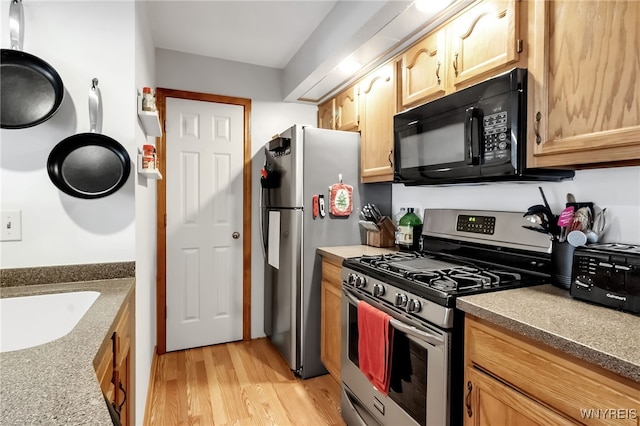 3 Keph Dr Unit 3, Amherst, NY 14228 - kitchen with appliances with stainless steel finishes and light wood-style floors