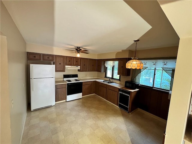 96 Vinal Ave, Irondequoit, NY 14609 - kitchen featuring white appliances, under cabinet range hood, a ceiling fan, light countertops, and pendant lighting