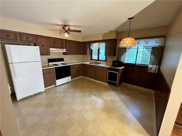96 Vinal Ave, Irondequoit, NY 14609 - kitchen featuring white appliances, light countertops, light floors, a ceiling fan, and pendant lighting