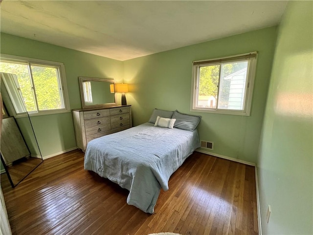 96 Vinal Ave, Irondequoit, NY 14609 - bedroom with wood-type flooring and multiple windows