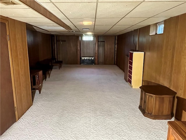 96 Vinal Ave, Irondequoit, NY 14609 - below grade area featuring light carpet, wooden walls, and a drop ceiling