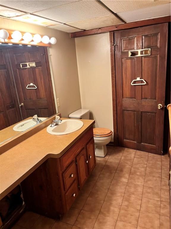 96 Vinal Ave, Irondequoit, NY 14609 - bathroom featuring vanity, tile patterned floors, and a paneled ceiling