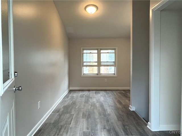 152 W Cayuga St, Oswego, NY 13126 - empty room featuring dark wood-type flooring and baseboards