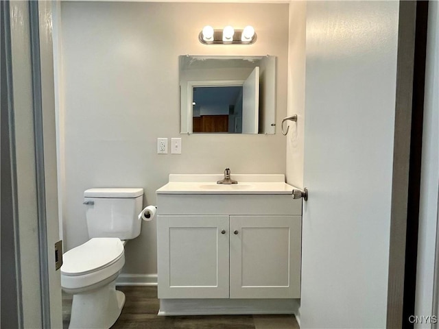 152 W Cayuga St, Oswego, NY 13126 - half bath with vanity and wood finished floors