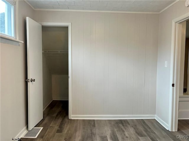 152 W Cayuga St, Oswego, NY 13126 - unfurnished bedroom featuring crown molding and dark wood finished floors