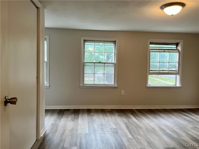 152 W Cayuga St, Oswego, NY 13126 - unfurnished room with dark wood-style flooring and plenty of natural light