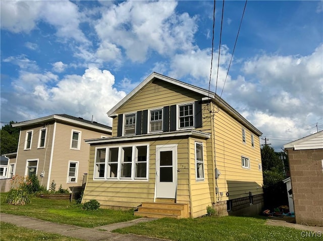 152 W Cayuga St, Oswego, NY 13126 - view of front of house with entry steps, a front yard, and crawl space