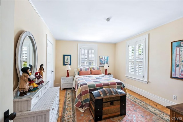 49 Academy St, Skaneateles, NY 13152 - bedroom with light wood-style floors, multiple windows, and ornamental molding