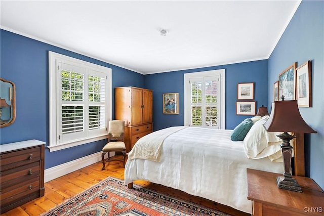 49 Academy St, Skaneateles, NY 13152 - bedroom with light wood-type flooring and ornamental molding