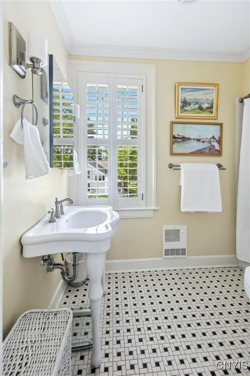 49 Academy St, Skaneateles, NY 13152 - bathroom featuring healthy amount of natural light and ornamental molding