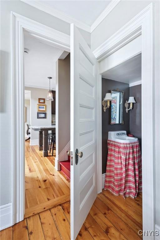 49 Academy St, Skaneateles, NY 13152 - hall featuring hardwood / wood-style flooring and ornamental molding