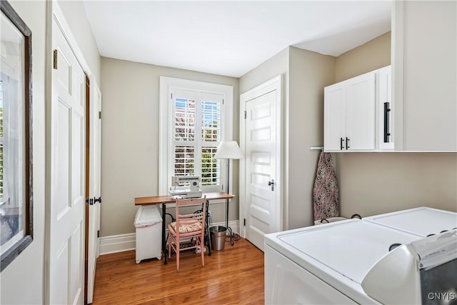 49 Academy St, Skaneateles, NY 13152 - laundry room featuring cabinet space, washing machine and dryer, light wood-style flooring, and an office area