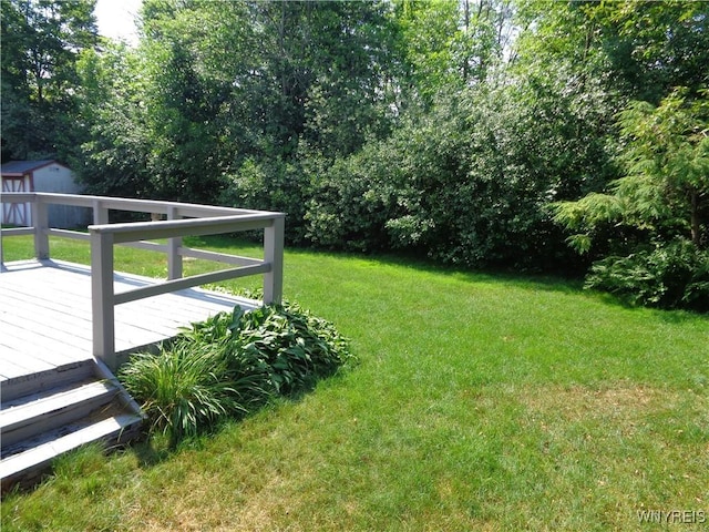 4315 Twilight Ln, Hamburg, NY 14075 - view of grassy yard featuring a storage shed and a wooden deck