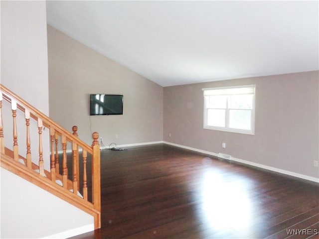4315 Twilight Ln, Hamburg, NY 14075 - unfurnished living room with dark wood-type flooring, lofted ceiling, and stairs