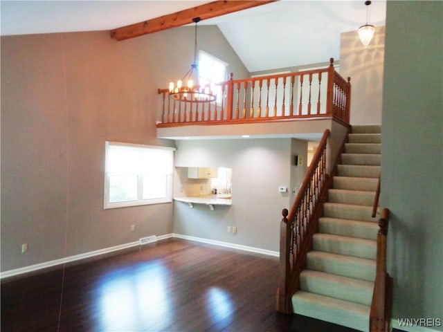 4315 Twilight Ln, Hamburg, NY 14075 - stairway featuring wood finished floors, a chandelier, high vaulted ceiling, and beam ceiling