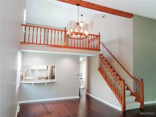 4315 Twilight Ln, Hamburg, NY 14075 - staircase featuring high vaulted ceiling, wood finished floors, a chandelier, and beam ceiling