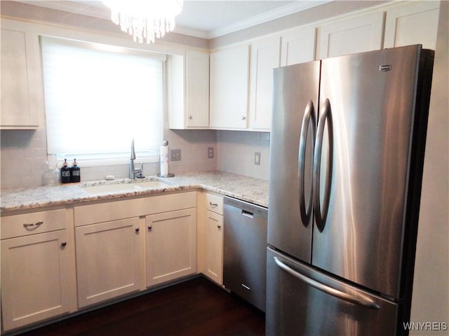 4315 Twilight Ln, Hamburg, NY 14075 - kitchen featuring appliances with stainless steel finishes, decorative backsplash, ornamental molding, light stone countertops, and white cabinets
