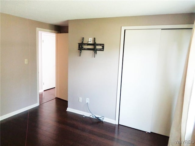 4315 Twilight Ln, Hamburg, NY 14075 - unfurnished bedroom with dark wood finished floors and a closet
