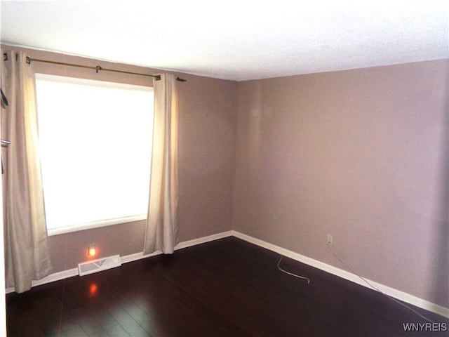 4315 Twilight Ln, Hamburg, NY 14075 - spare room featuring dark wood-type flooring and baseboards