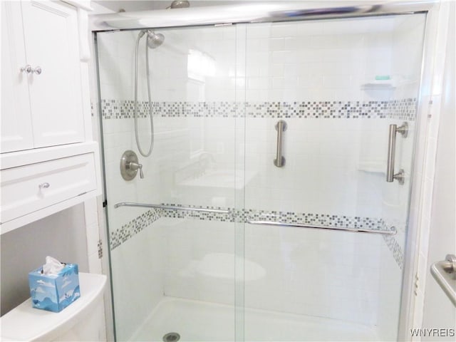 4315 Twilight Ln, Hamburg, NY 14075 - bathroom featuring a stall shower and toilet