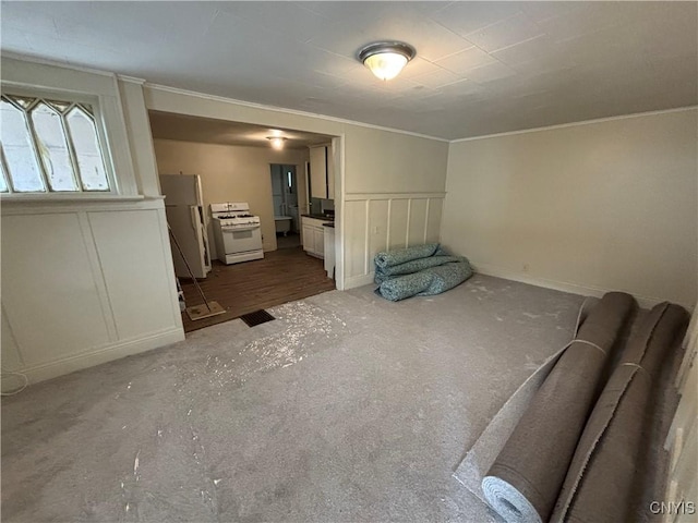 1011 Carbon St Unit 2, Syracuse, NY 13208 - unfurnished living room with carpet flooring, ornamental molding, a decorative wall, and wainscoting