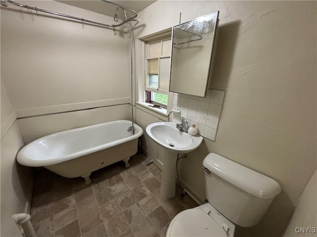 1011 Carbon St Unit 2, Syracuse, NY 13208 - bathroom with toilet and stone finish floors