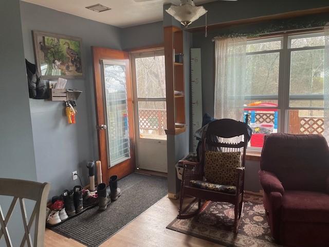 1571 State Highway 7, Afton, NY 13730 - living area featuring healthy amount of natural light, ceiling fan, and wood finished floors