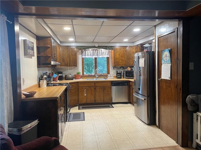 1571 State Highway 7, Afton, NY 13730 - kitchen featuring stainless steel appliances, light floors, recessed lighting, open shelves, and brown cabinetry