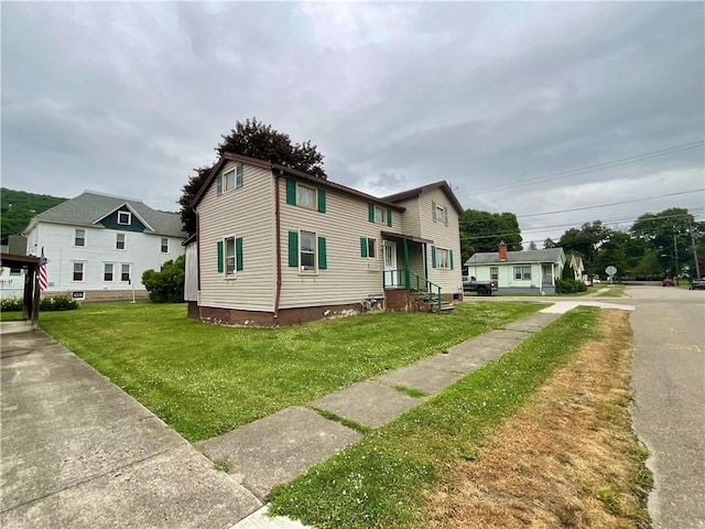 27 Chestnut Ave, North Dansville, NY 14437 - view of front facade featuring a front lawn