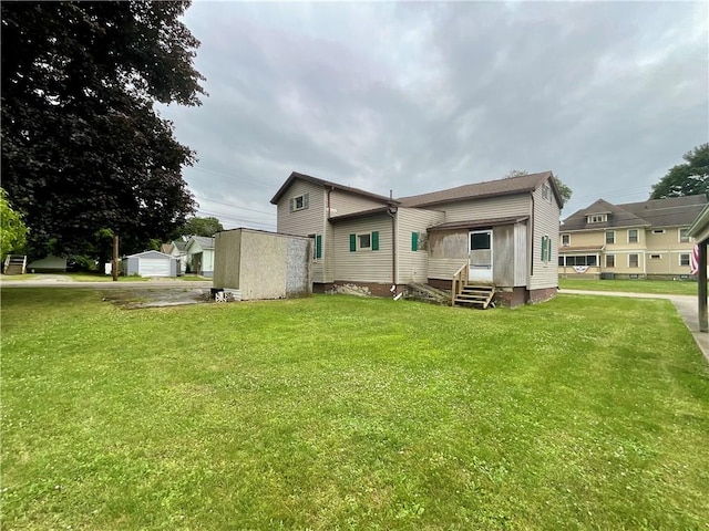 27 Chestnut Ave, North Dansville, NY 14437 - back of house with a yard