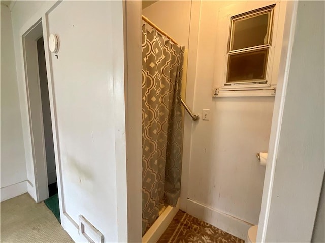 27 Chestnut Ave, North Dansville, NY 14437 - bathroom featuring a shower with shower curtain and toilet