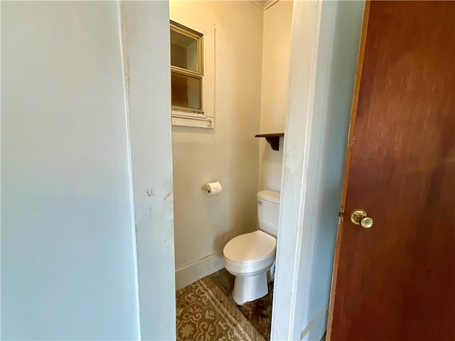 27 Chestnut Ave, North Dansville, NY 14437 - bathroom featuring toilet and baseboards