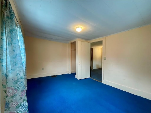 27 Chestnut Ave, North Dansville, NY 14437 - unfurnished bedroom with dark colored carpet and baseboards